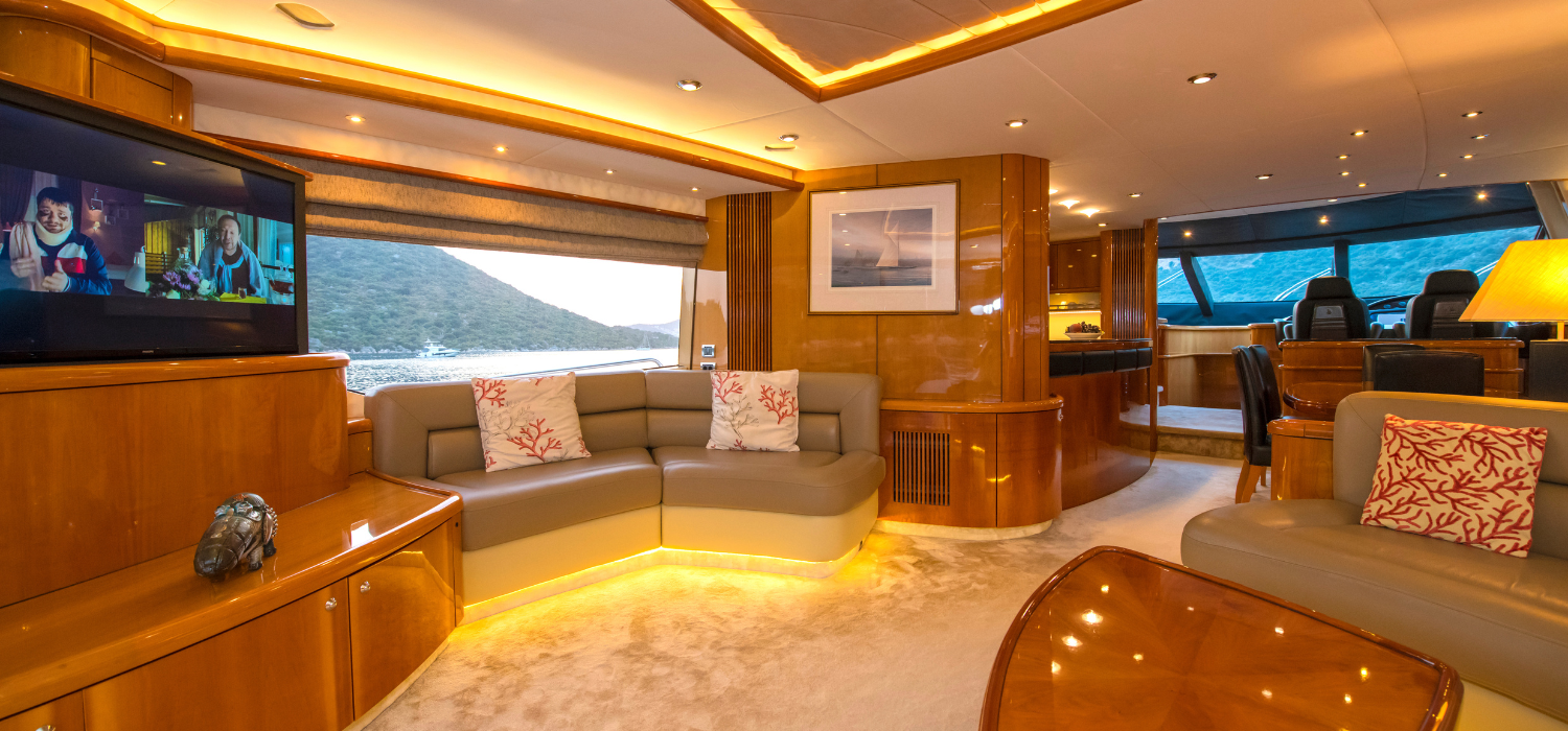 Interior shot featuring the main salon with luxury leather sofas, large-screen sofas and LED lights along the panelling 