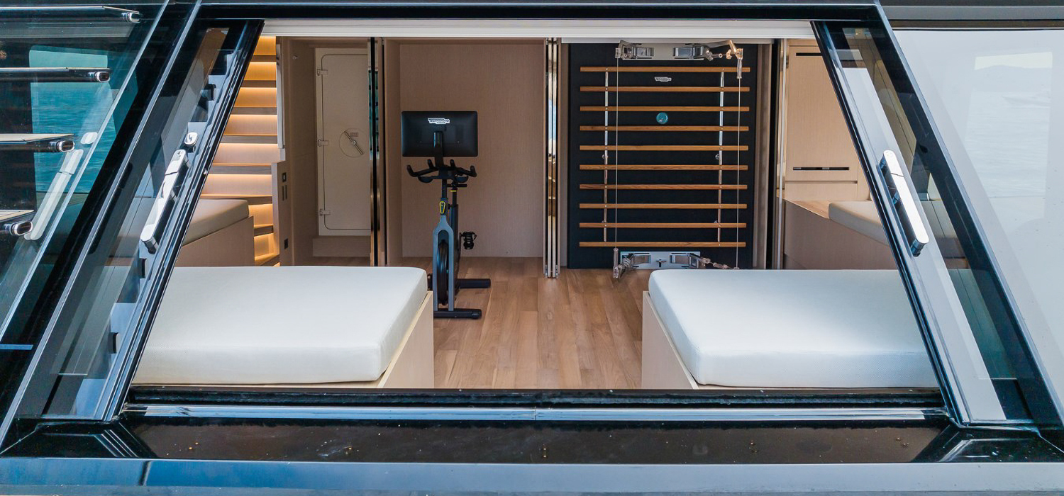 Gym and beach club on board luxury motor yacht Ami